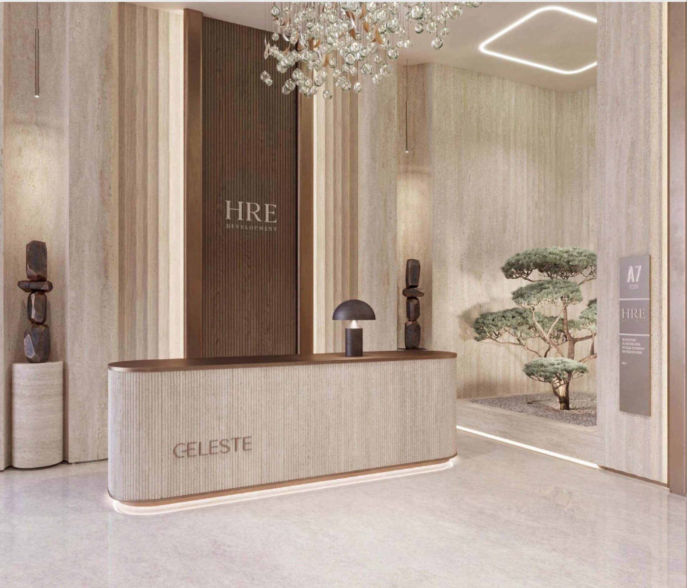Celeste — concierge desk with warm travertine and bronze finishes